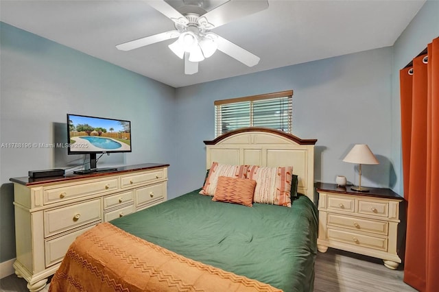 bedroom with a ceiling fan and wood finished floors