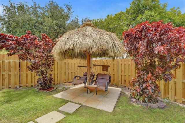 view of yard with a patio and a fenced backyard
