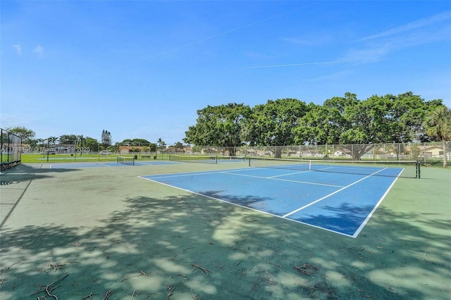 view of sport court featuring fence
