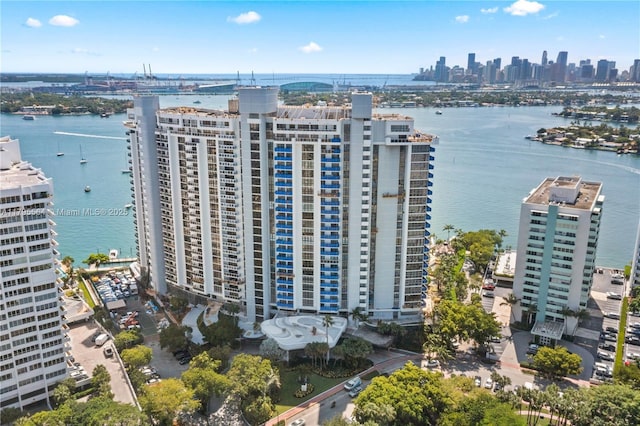 bird's eye view featuring a water view and a view of city
