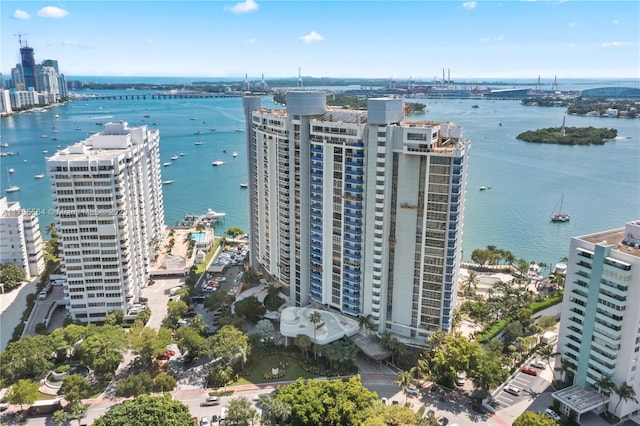 drone / aerial view with a city view and a water view
