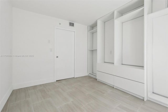 walk in closet with visible vents