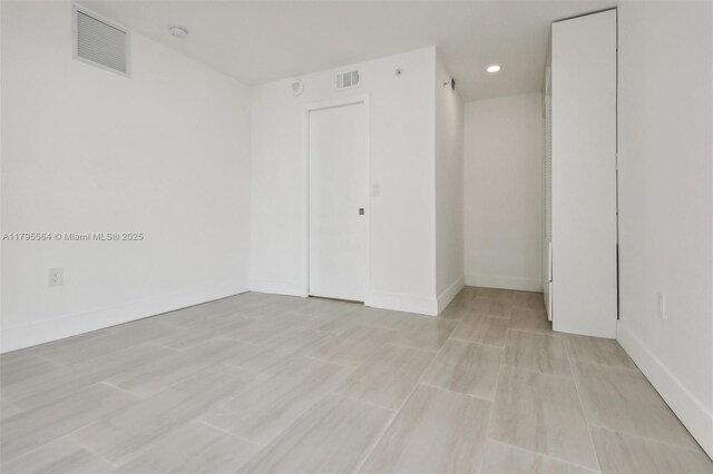 9 Island Ave Unit 1209, Miami Beach, FL 33139 - unfurnished room featuring visible vents, baseboards, and recessed lighting