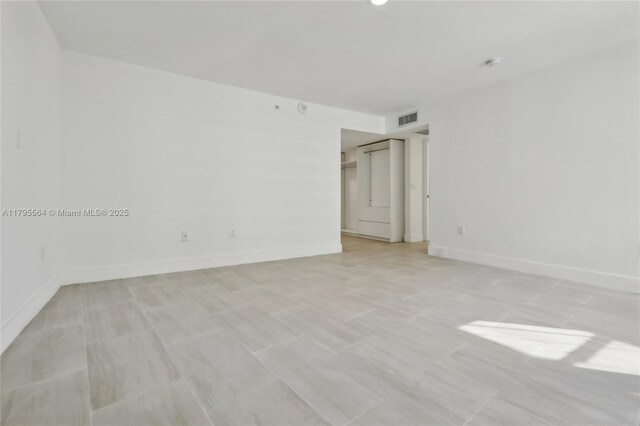 9 Island Ave Unit 1209, Miami Beach, FL 33139 - unfurnished room featuring baseboards