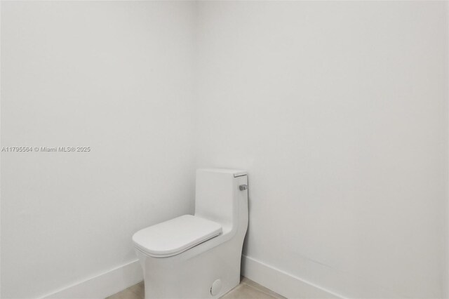 9 Island Ave Unit 1209, Miami Beach, FL 33139 - bathroom with baseboards and toilet