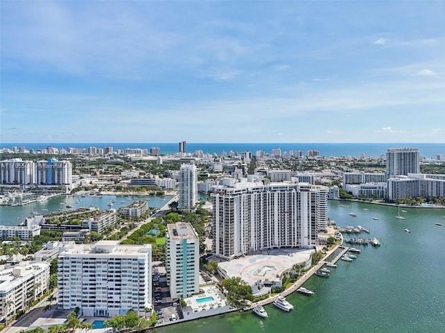 bird's eye view featuring a water view and a view of city