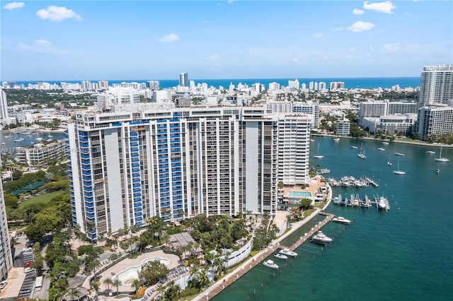 aerial overview of property's location featuring a nearby body of water and nearby urban area
