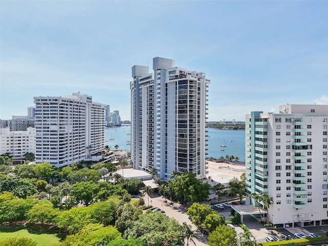 view of urban area featuring a nearby body of water
