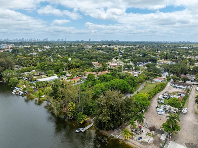 15100 NW River Dr, Miami, FL 33169 - aerial view of property and surrounding area with city skyline, a tree filled landscape, and a large body of water