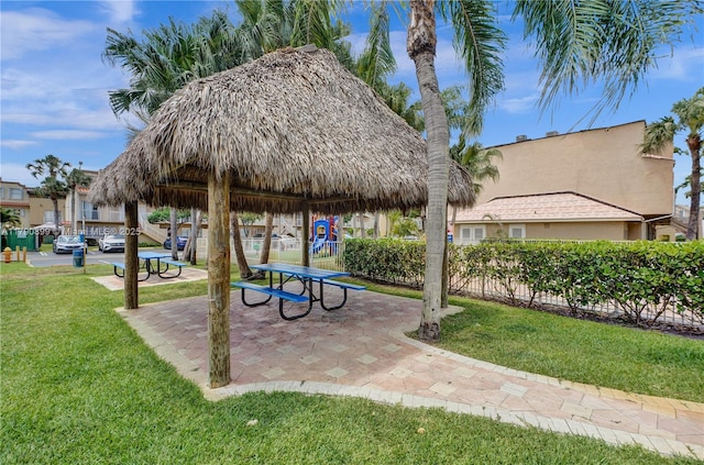 surrounding community featuring a lawn and playground community
