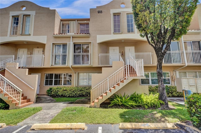 view of property featuring stairway