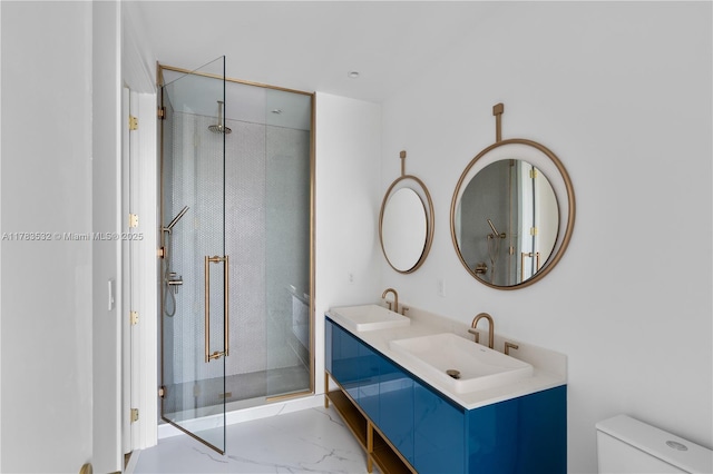 full bathroom with toilet, a shower stall, a sink, and marble finish floor
