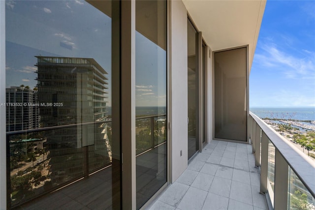 balcony featuring a water view