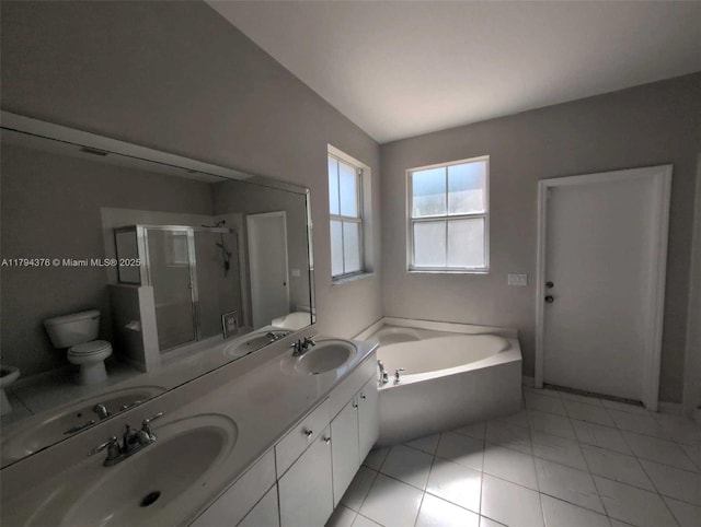bathroom featuring toilet, a shower stall, a sink, and a bath