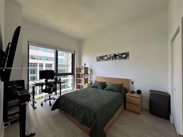 121 NE 34th St Unit L601, Miami, FL 33137 - full bathroom featuring a stall shower, tile patterned flooring, and toilet