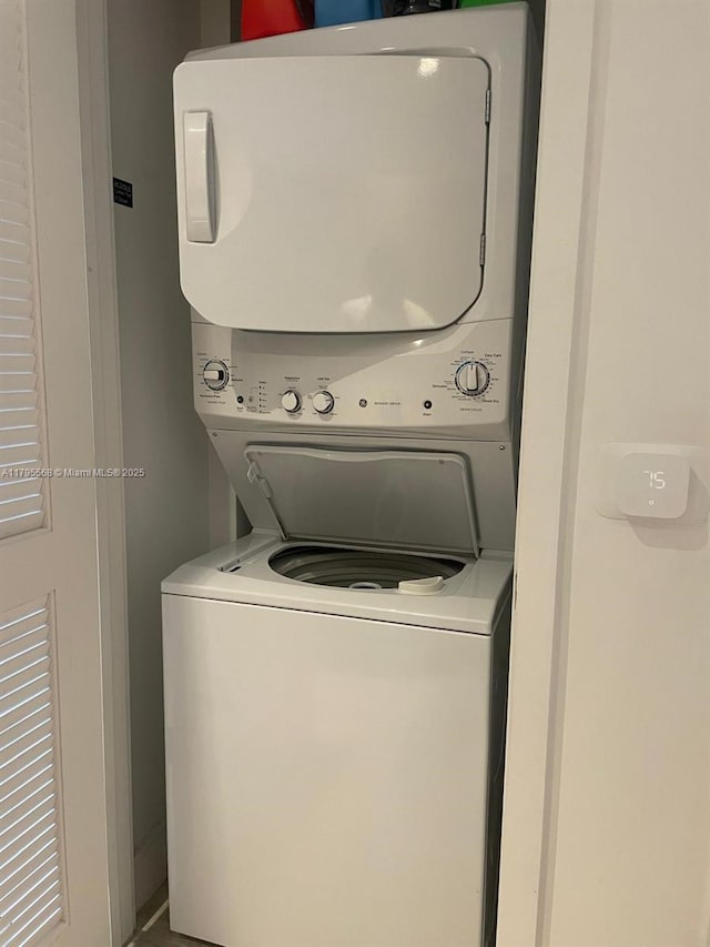 laundry room featuring laundry area and stacked washing maching and dryer