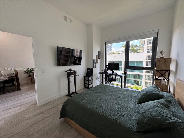121 NE 34th St Unit L601, Miami, FL 33137 - laundry room with stacked washer / dryer and laundry area