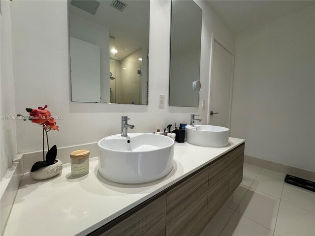 121 NE 34th St Unit L601, Miami, FL 33137 - full bath featuring a stall shower, double vanity, and tile patterned flooring