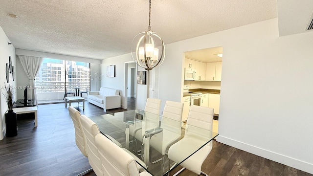 3300 NE 192nd St Unit Ph09, Aventura, FL 33180 - dining area featuring a chandelier, a textured ceiling, dark wood-style floors, and baseboards