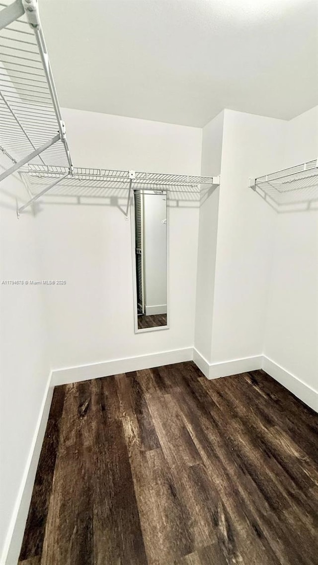 3300 NE 192nd St Unit Ph09, Aventura, FL 33180 - walk in closet featuring wood finished floors