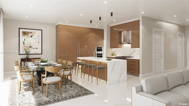 626 Malaga Ave, Coral Gables, FL 33134 - kitchen featuring wall chimney range hood, brown cabinets, modern cabinets, recessed lighting, and a kitchen breakfast bar