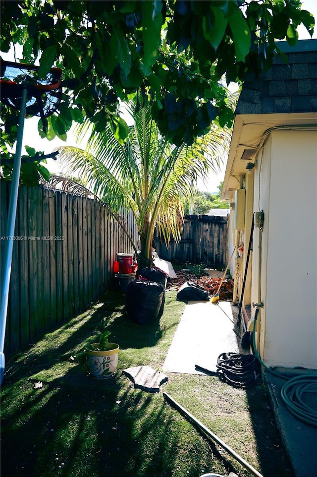 view of yard featuring a patio and a fenced backyard