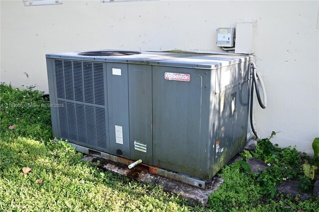 exterior details with stucco siding and cooling unit