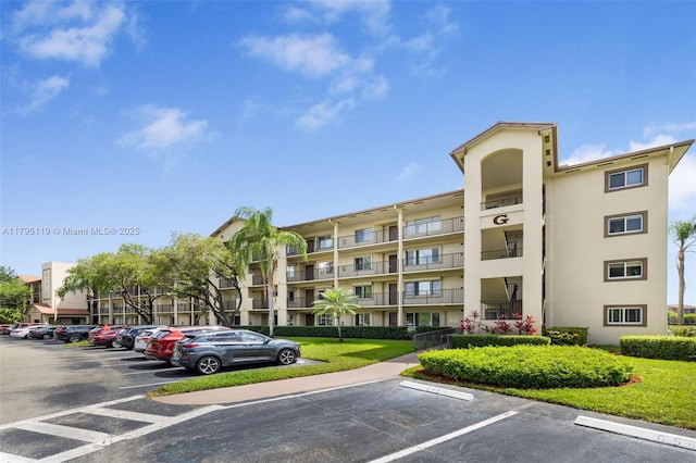 1351 SW 141st Ave Unit 313G, Pembroke Pines, FL 33027 - view of apartment building / complex with uncovered parking
