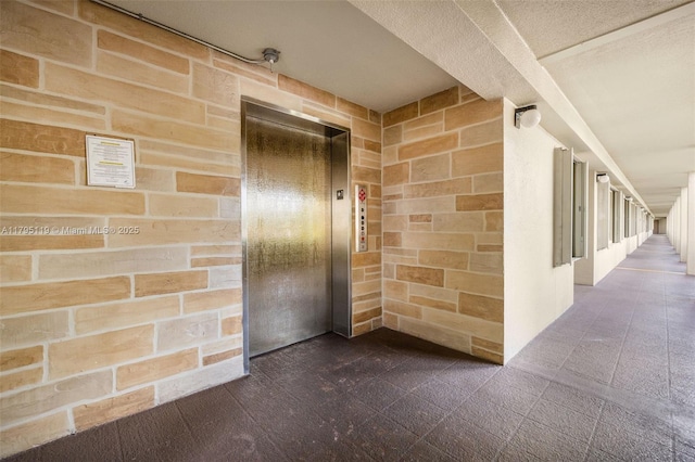 entrance to property featuring elevator