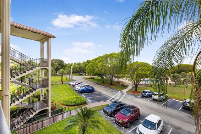 1351 SW 141st Ave Unit 313G, Pembroke Pines, FL 33027 - uncovered parking lot featuring stairs