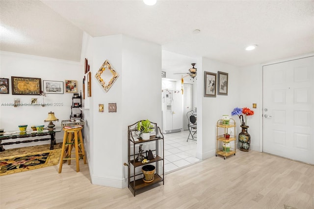 foyer featuring baseboards, a ceiling fan, recessed lighting, and wood finished floors