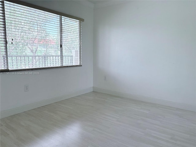 1351 SW 141st Ave Unit 313G, Pembroke Pines, FL 33027 - empty room featuring wood finished floors and baseboards