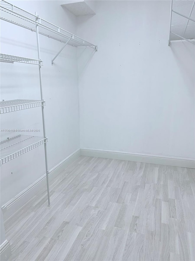 1351 SW 141st Ave Unit 313G, Pembroke Pines, FL 33027 - spacious closet featuring wood finished floors