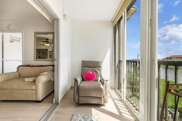 sunroom featuring a healthy amount of sunlight and wood finished floors