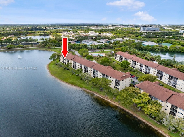 bird's eye view with a water view