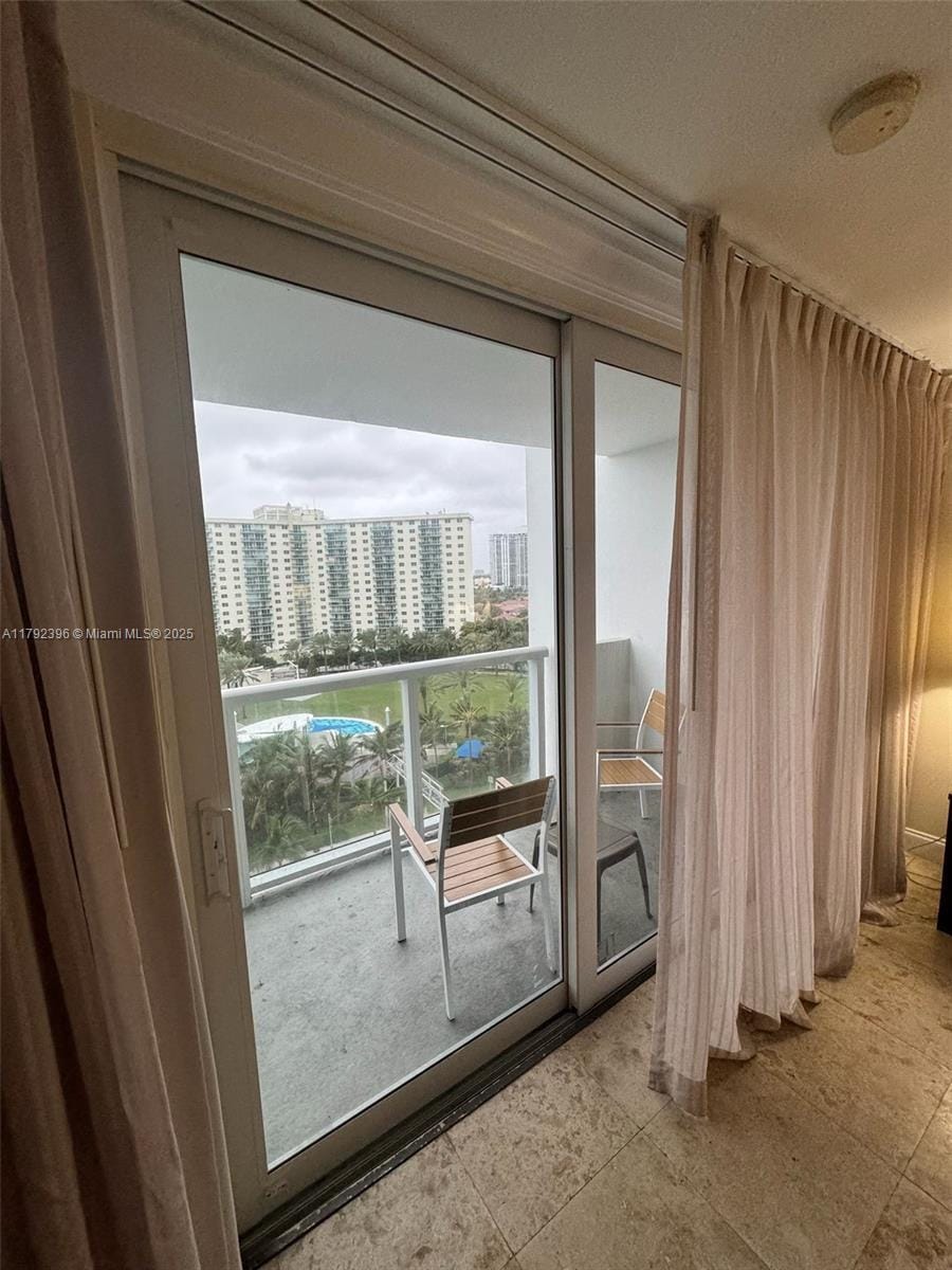 19201 Collins Ave Unit 831, Sunny Isles Beach, FL 33160 - doorway to outside with tile patterned flooring and a view of city