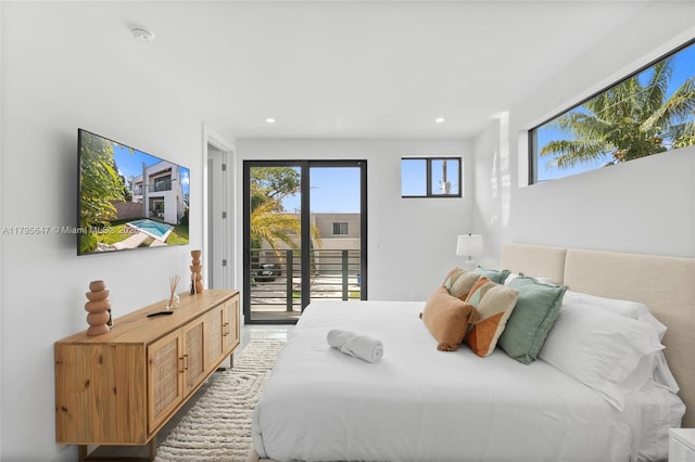 bedroom featuring access to exterior and recessed lighting