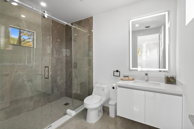 bathroom with toilet, a shower stall, vanity, tile patterned floors, and recessed lighting