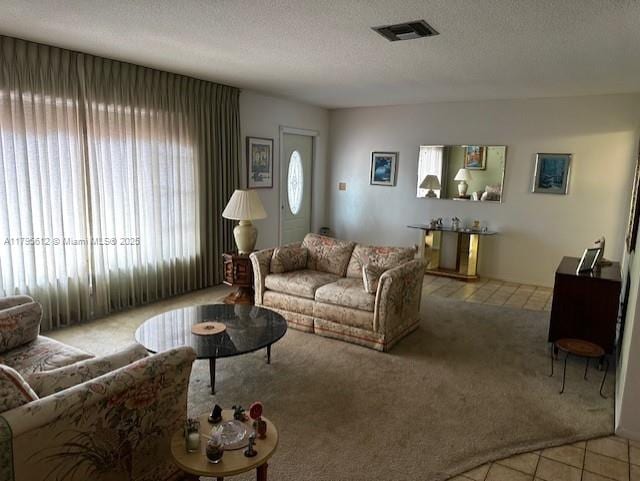 7206 NW 89th Ave, Tamarac, FL 33321 - living area with light carpet, light tile patterned floors, and a textured ceiling
