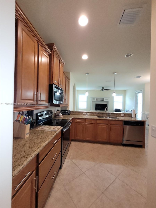 1080 SW Southlakes Way SW, Vero Beach, FL 32968 - kitchen featuring visible vents, open floor plan, plenty of natural light, a sink, and appliances with stainless steel finishes