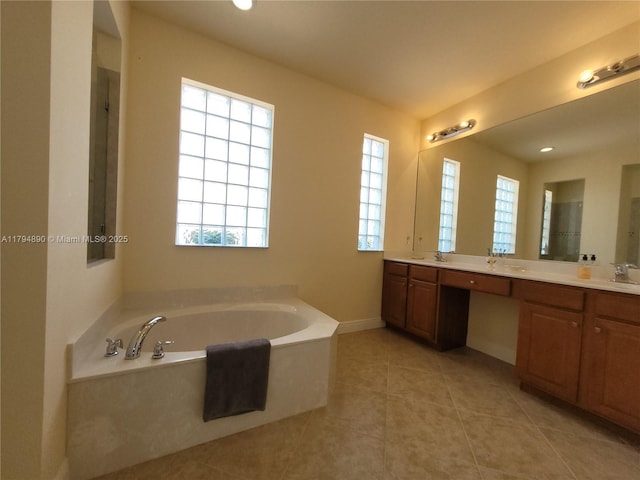 1080 SW Southlakes Way SW, Vero Beach, FL 32968 - bathroom with a sink, tile patterned flooring, double vanity, baseboards, and a garden tub