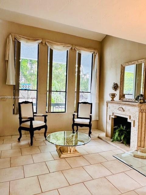 living area featuring light tile patterned flooring