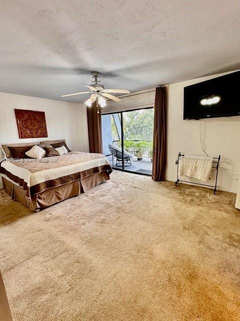 carpeted bedroom featuring a textured ceiling, ceiling fan, and access to exterior