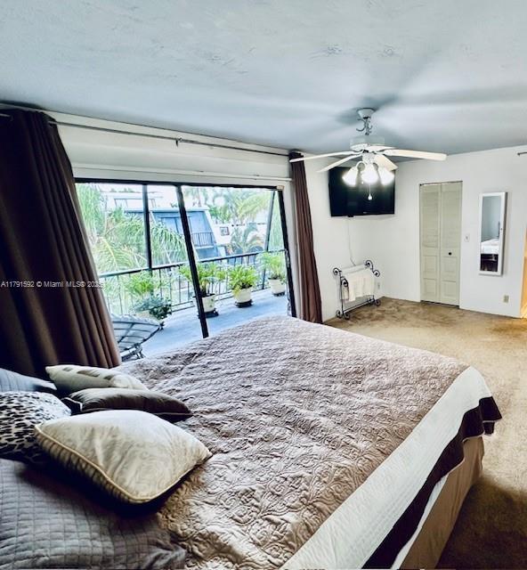 carpeted bedroom with access to outside