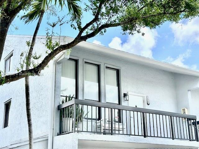 view of side of home featuring stucco siding