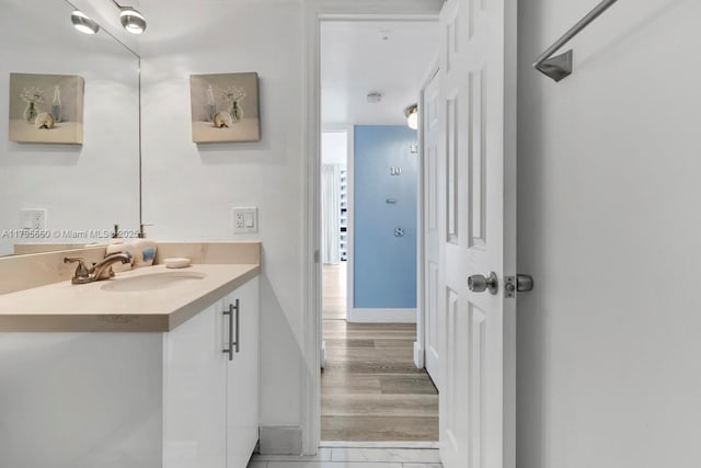 bathroom featuring baseboards and vanity