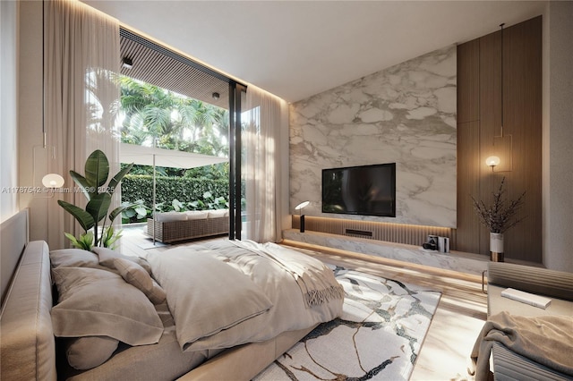 bedroom featuring stone wall