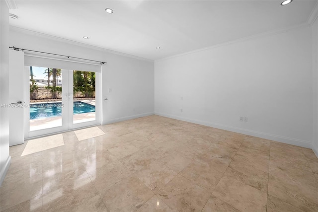 spare room featuring crown molding, recessed lighting, baseboards, and french doors