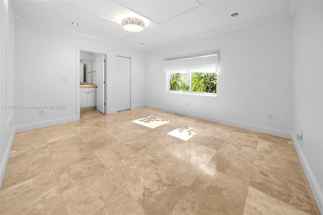 unfurnished bedroom featuring crown molding and baseboards