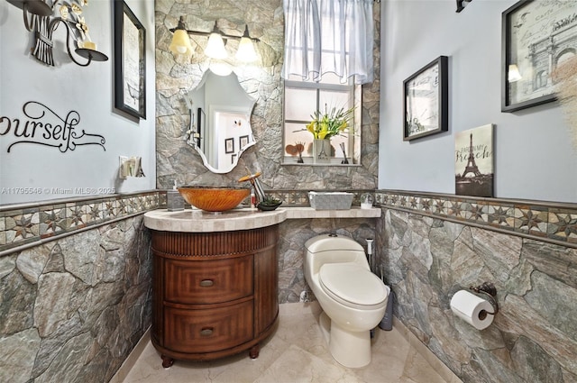 15870 NW 10th St, Pembroke Pines, FL 33028 - half bath with tile walls, a wainscoted wall, toilet, and vanity